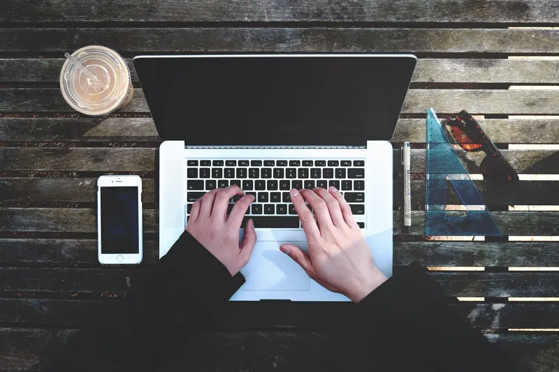 A laptop and a smartphone on a desk